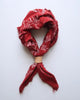 Red bandana with white patterns
