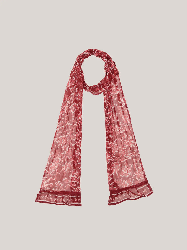 Red floral patterned scarf on a light gray background
