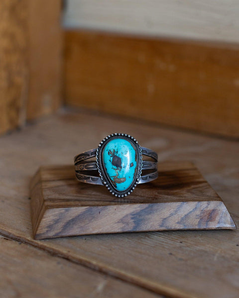 Navajo Stamped Silver Bracelet with Turquoise - Crossbow